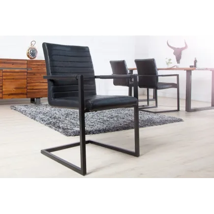 Lot de 4 chaises alliant simili cuir noir laqué et acier inoxydable